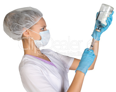 Female doctor picking up the syringe injection