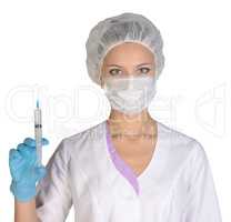 Doctor a masked holds before him syringe in hand