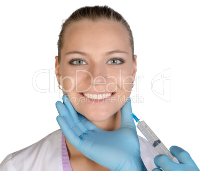 Joyful girl injected with a syringe of Botox. Isolated on white background