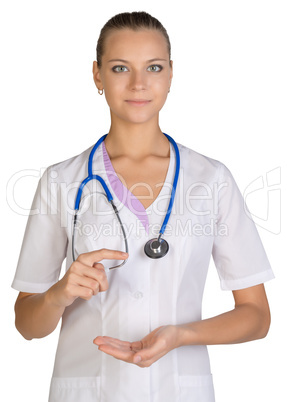 Healthcare. Female doctor pointing to something or pressing imaginary button