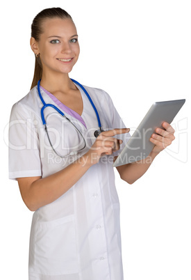 Woman doctor holding a tablet showing forefinger on the screen