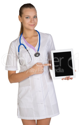 Woman doctor holding a tablet showing forefinger on the screen