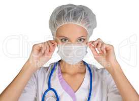 Young woman doctor in cap and face mask on white background