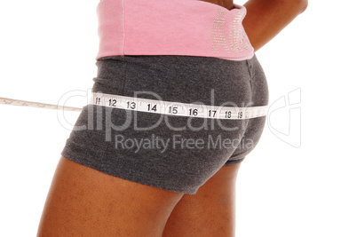 Girl measuring her butt, body part.