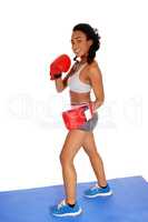 Boxer woman during boxing exercise.