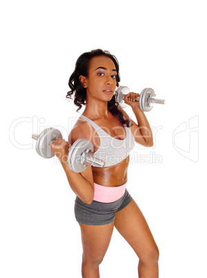 Young lady exercising with dumbbell's.