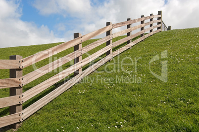 Wooden fence on a dyke.
