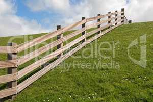 Wooden fence on a dyke.