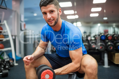 Close up of fit man working out with weights