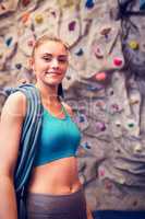 Fit woman at the rock climbing wall