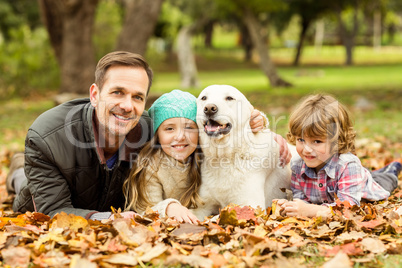 Smiling young family with dog