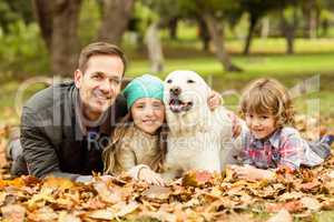 Smiling young family with dog