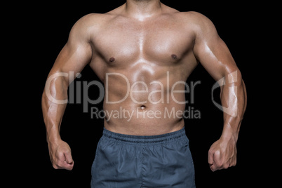 Mid section of a bodybuilder man