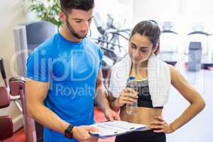 Trainer and athlete discussing workout plan