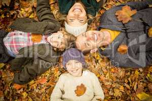 Smiling young family doing a head circles
