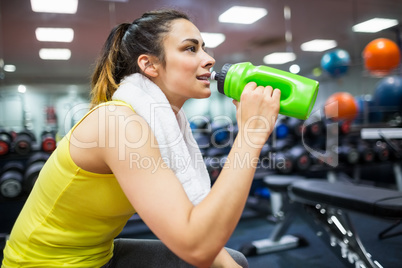 Woman taking a drink from her water bottle