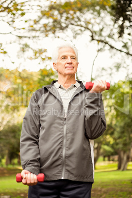 Senior man working out in park