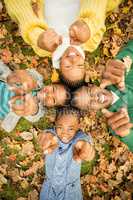 Young family doing a head circles and pointing the camera