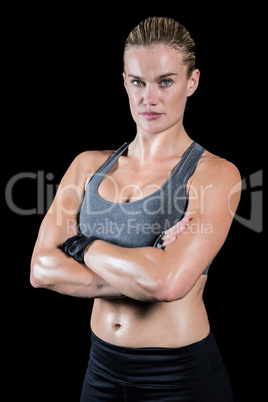 Muscular woman with arms crossed Muscular woman with arms crossed