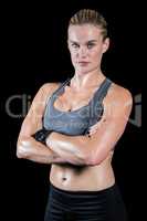 Muscular woman with arms crossed