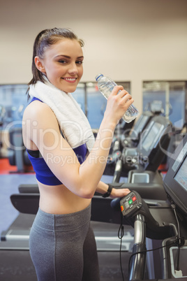 Fit woman taking a drink