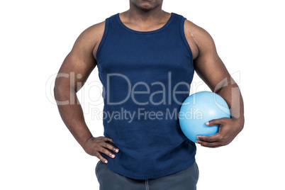 Muscular man working out with weight