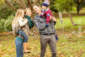 Smiling young family looking each other