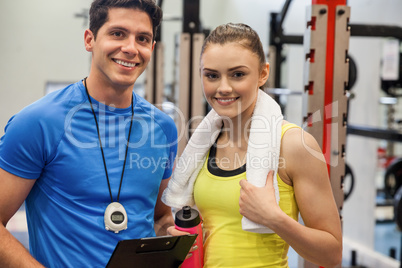 Trainer and woman discussing workout plan