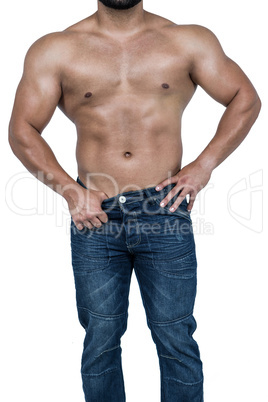 Muscular man wearing blue jeans