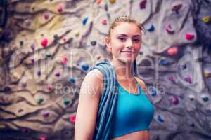 Fit woman at the rock climbing wall