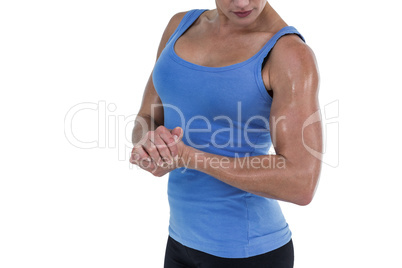 Muscular woman flexing her muscle