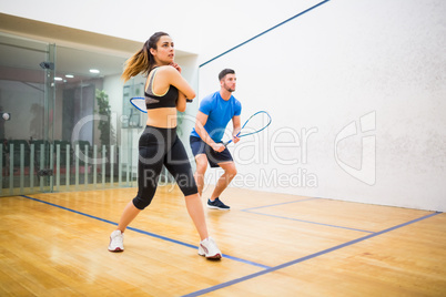 Couple play some squash together