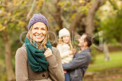 Smiling woman against her husband and her daughter