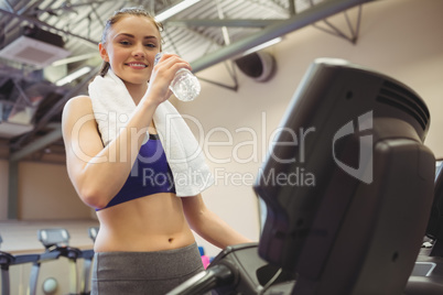 Fit woman taking a drink