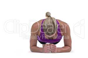 Muscular woman doing push ups