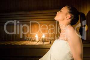 Pretty woman relaxing in the sauna