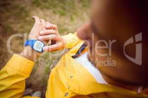 Man using his smartwatch on a hike