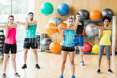 Fitness class exercising in the studio