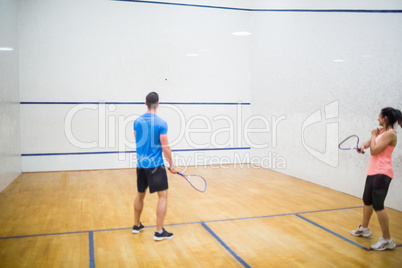 Couple play some squash together