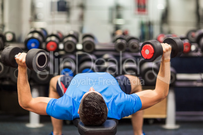 Man using weights in his workout