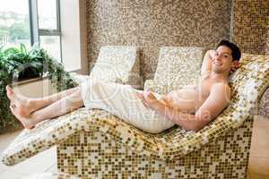 Handsome man relaxing in thermal suite