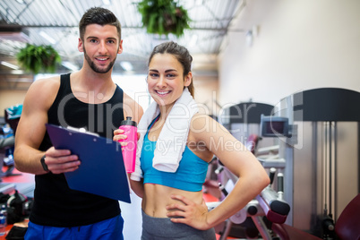 Trainer explaining workout regime to woman