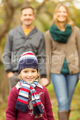 Smiling young family walking together