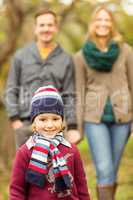 Smiling young family walking together