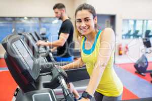 Couple using treadmills together