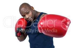 Fit man boxing with gloves