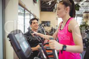 Fit woman working out with trainer