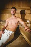 Man sitting inside a sauna