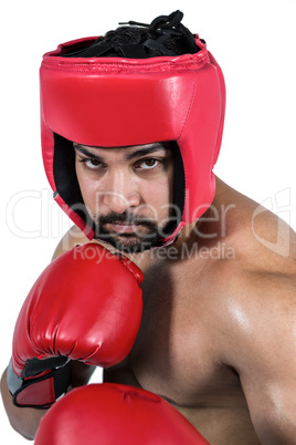 Muscular man boxing in gloves