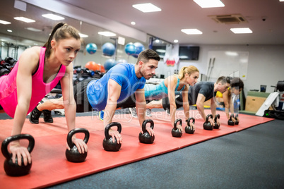 Fit people working out in fitness class